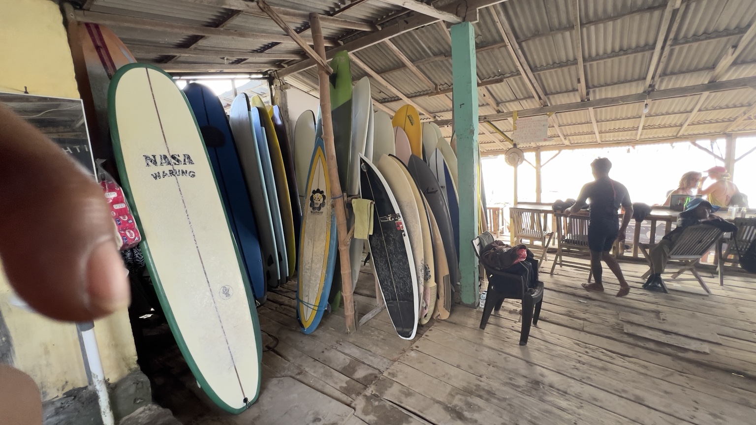 NASA surfboards ready at the beach warung