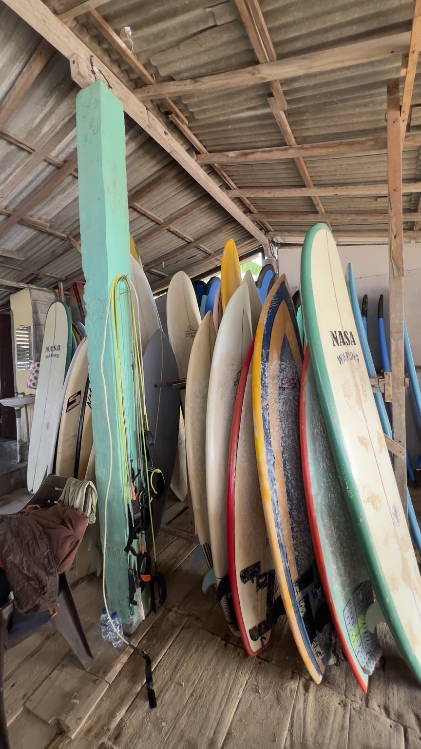 Surfboards and open-air seating at NASA Warung